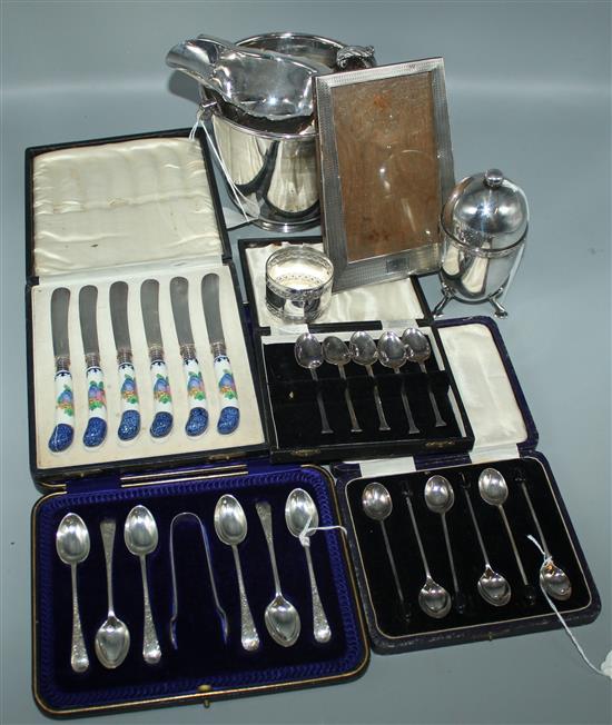 Set of 6 silver teaspoons and tongs, cased, silver easel frame, plated ice bucket, sauce boat, plated flatware etc